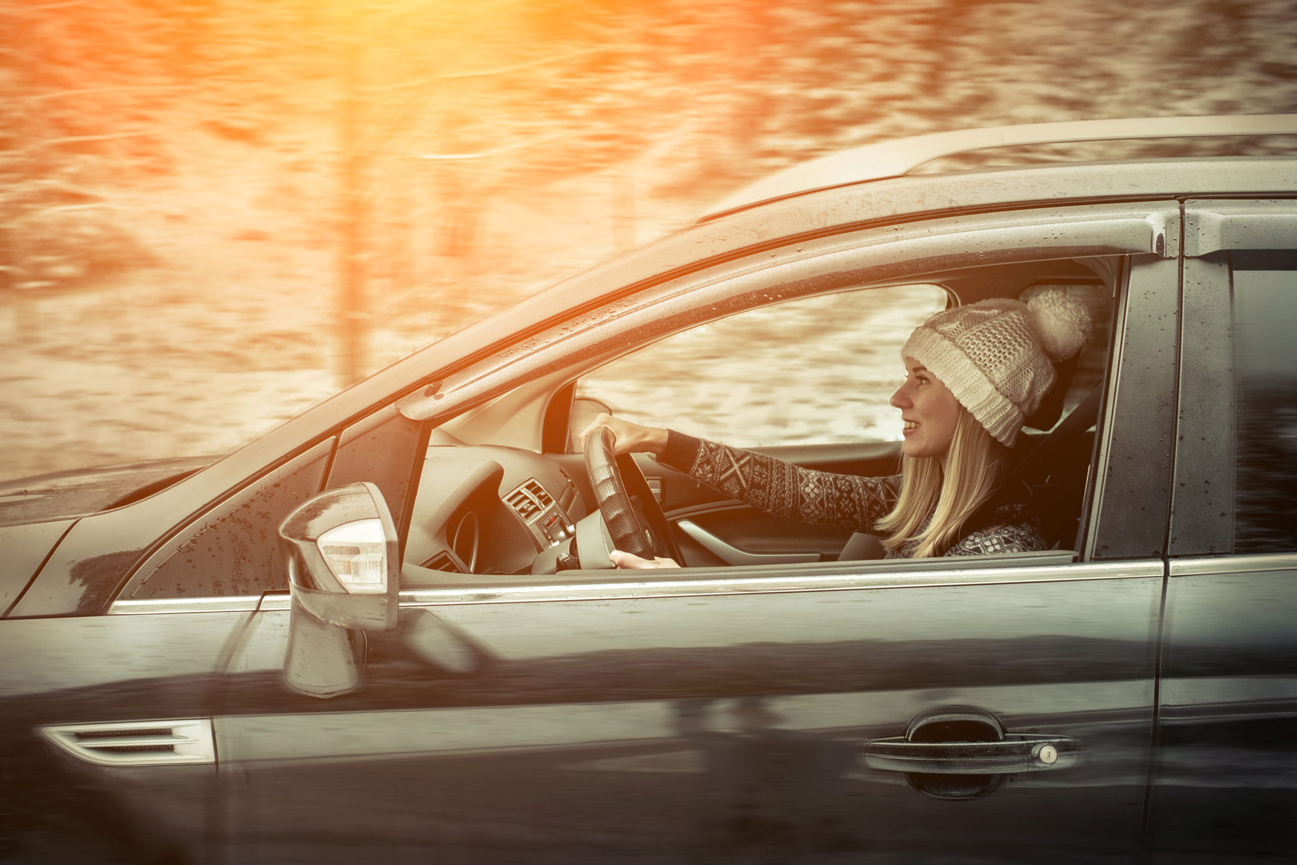 Woman,At,Winter,Time.,Yoyng,Female,Sitting,And,Driving,In